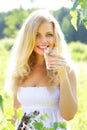 Girl with a glass of water in nature Royalty Free Stock Photo