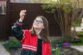 A girl in glasses holds a small bird egg in her hand Royalty Free Stock Photo