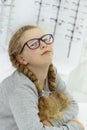 girl with glasses. rows of spectacles