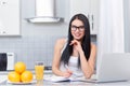 Girl in glasses studding on kitchen. Royalty Free Stock Photo