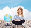 Girl with globe and book Royalty Free Stock Photo