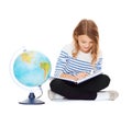 Girl with globe and book Royalty Free Stock Photo