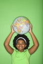 Girl with globe on head. Royalty Free Stock Photo