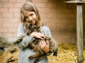 Girl with goatling Royalty Free Stock Photo