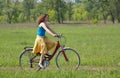 Girl goes by bicycle Royalty Free Stock Photo