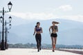 The girl goes in for sports, runs in the morning along the promenade by the sea