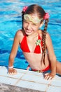 Girl with goggles, red swimsuit in swimming pool Royalty Free Stock Photo