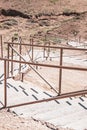 girl going down in desert mountains along organized stairs Royalty Free Stock Photo