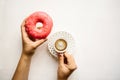 The girl is going to drink coffee and eat a donut Royalty Free Stock Photo