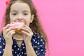 Girl going to eat a sweet donut. Royalty Free Stock Photo