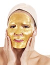 Girl with gold facial mask.