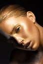 Girl with gold and silver skin in the image of an Oscar. Art image beauty face.