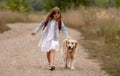 Girl with golden retriever dog Royalty Free Stock Photo