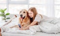 Girl with golden retriever dog and smartphone Royalty Free Stock Photo