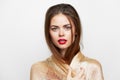 A girl in a golden scarf Red lips studio glamor elegant style Royalty Free Stock Photo