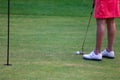 Girl golfer prepare for hitting iron during golf workout Royalty Free Stock Photo