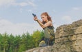 Girl in a governmental form to aim with a gun Royalty Free Stock Photo