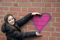 Girl and graffiti heart Royalty Free Stock Photo