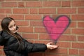 Girl and graffiti heart Royalty Free Stock Photo