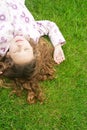 Girl on grass in park. Royalty Free Stock Photo