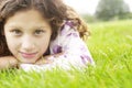 Girl on grass in park.