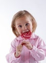 Girl with great pleasure have lollipop Royalty Free Stock Photo