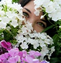 Girl with green eyes in flowers