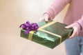 A girl and green gift box in Christmas Eve