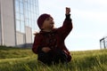 The girl on a green grass in a sunlight