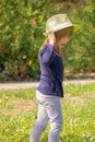 A girl with a green hat