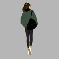 A girl in a green jacket and with a black backpack