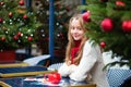 Girl with greeting cards in a Parisian cafe