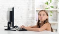 A girl grimaced front of a computer Royalty Free Stock Photo