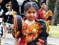 Girl with group of folk dancers represent Bolivian dance