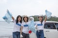 Girl group volunteers holding rubbish bags. clean up garbage in tourist attractions. contribute garbage collection volunteer