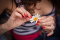 Girl guesses on a flower Royalty Free Stock Photo