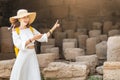 history teacher tells students or tourists a lecture about ancient Greece in the Acropolis. Education and tourism