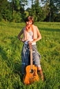 Girl with guitar outdoors Royalty Free Stock Photo