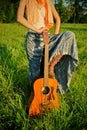 Girl with guitar outdoors Royalty Free Stock Photo