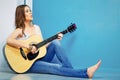 Girl guitar play and sings