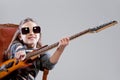 Girl with guitar and sunglasses Royalty Free Stock Photo