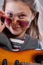 Girl with guitar and sunglasses Royalty Free Stock Photo