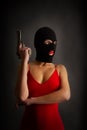 Girl gun balaclava red Royalty Free Stock Photo