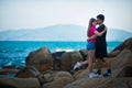 Girl and guy kissing on the background of the sea Royalty Free Stock Photo