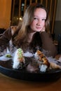 Girl or a guy takes a sushi roll with chinese chopsticks and dips the sushi in soy sauce. Close-up Royalty Free Stock Photo