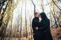 The girl and the guy are walking in the autumn forest Royalty Free Stock Photo