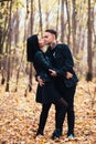 The girl and the guy are walking in the autumn forest Royalty Free Stock Photo