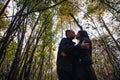 The girl and the guy are walking in the autumn forest Royalty Free Stock Photo