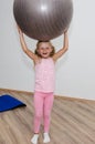 Girl with gym ball Royalty Free Stock Photo