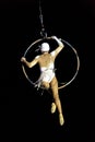 Girl gymnast in the circus. Aerial ring. Russian Circus. A gymnast under the dome of a circus.